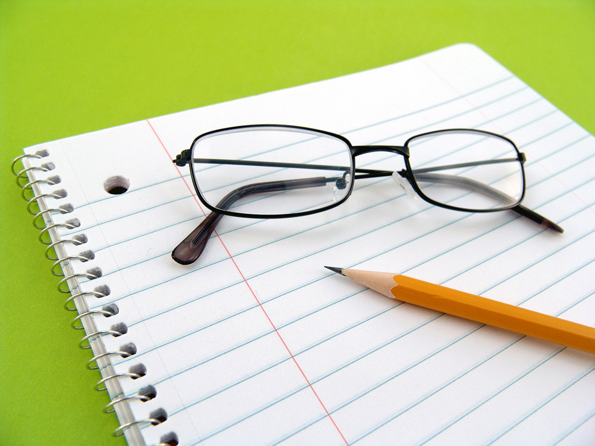 Free Notebook with Glasses and Pencil Stock Photography