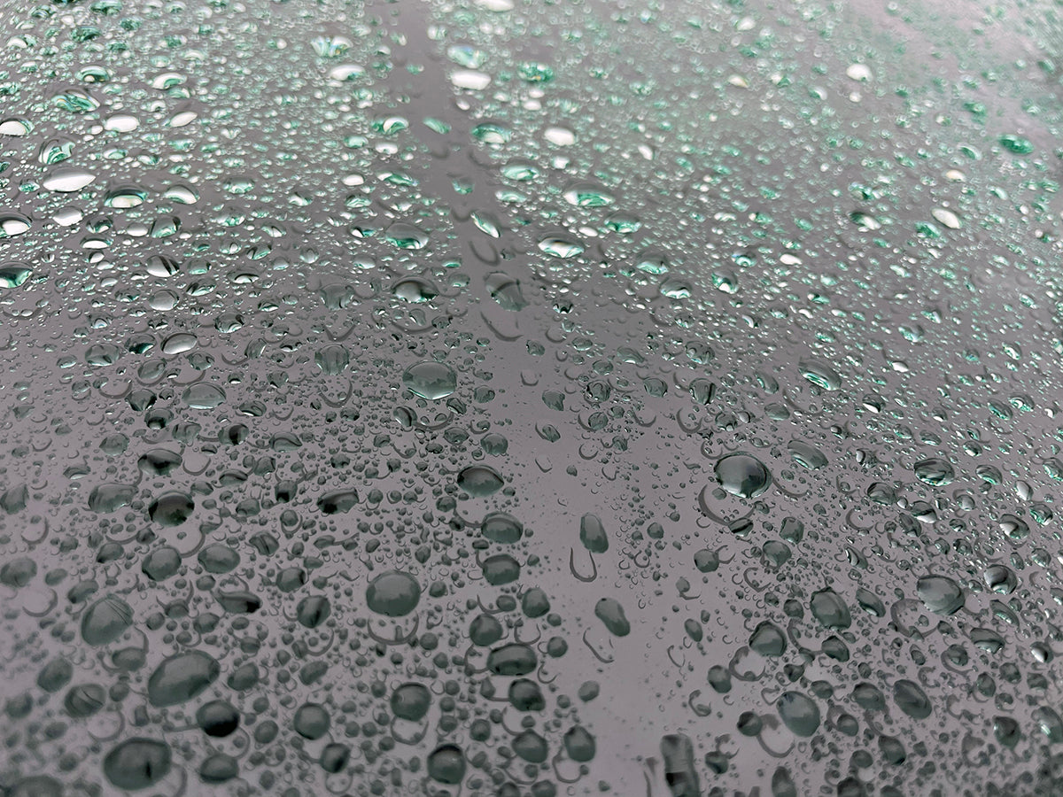 Free Green Tinted Water Droplets on Glass Stock Photography