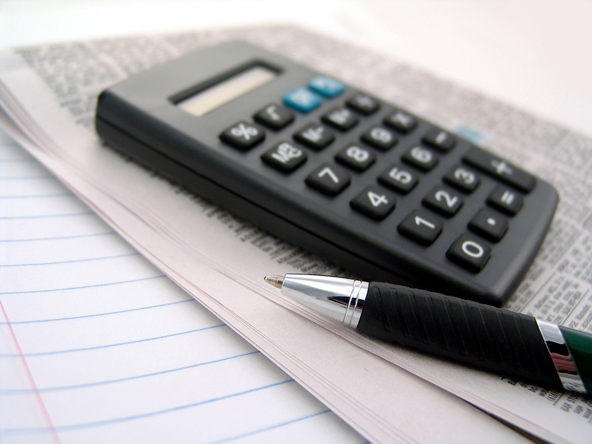 Free Calculator and Pen on Paper Stock Photography