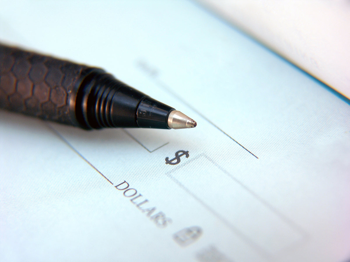 Free Pen on Check Stock Photography