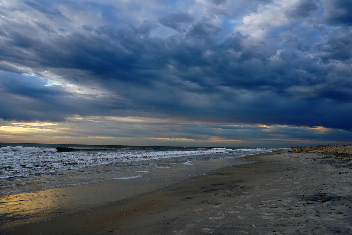 Free Storm Clouds and Rolling Surf on the Coast Stock Photography