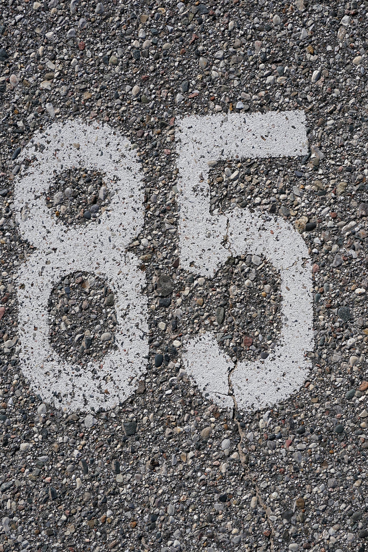 Free Number 85 on Cracked Pavement Stock Photography