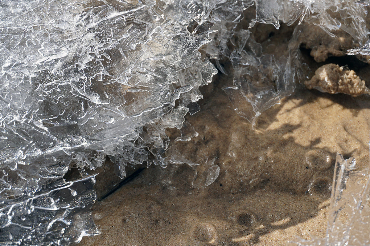 Free Melting Ice Over Sand Stock Photography