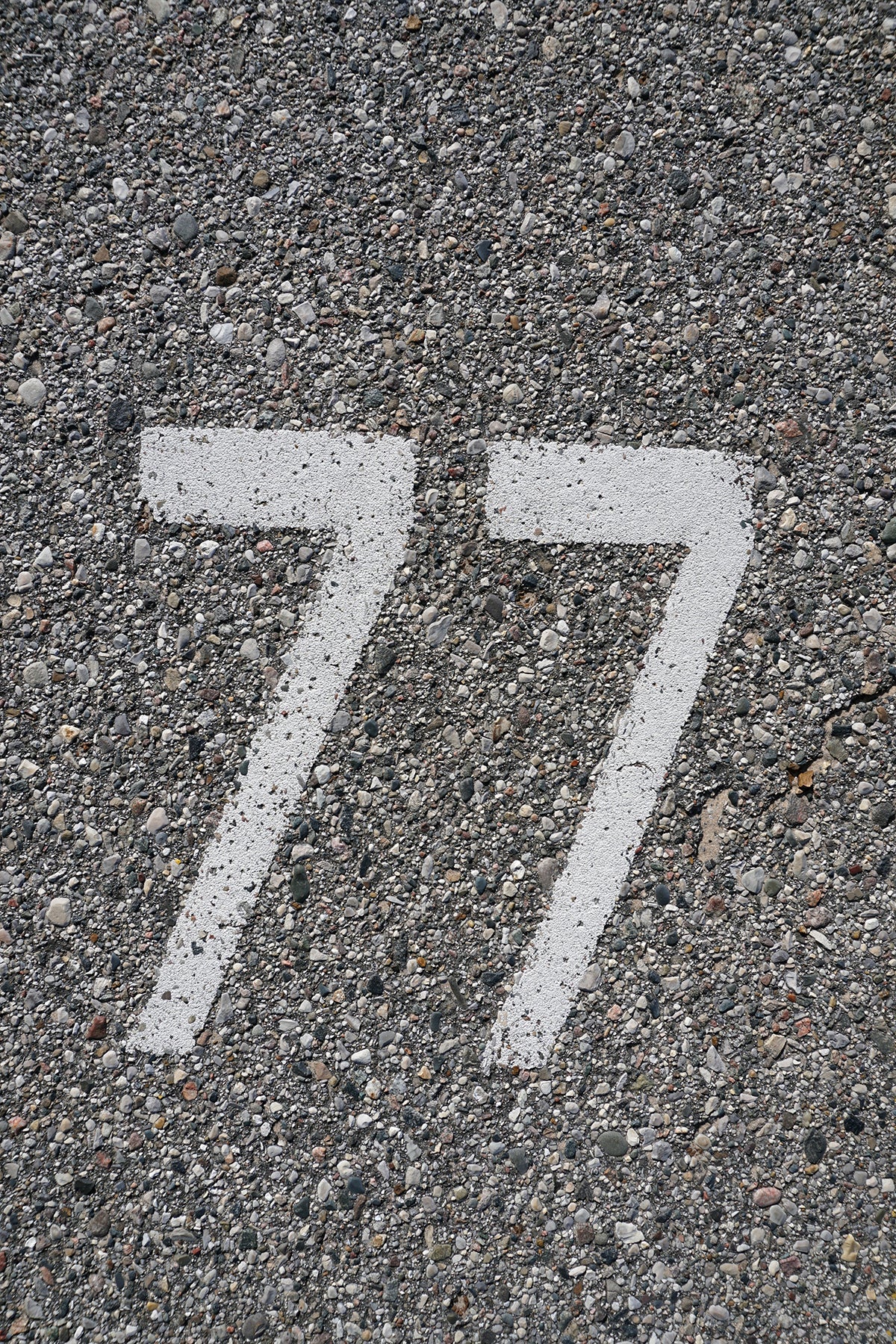 Free Parking Spot Number 77 - Closeup Stock Photography