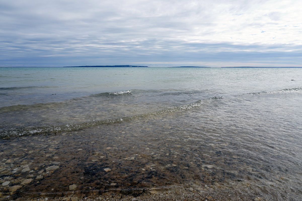 Free Waves on a Calm Lake Stock Photography