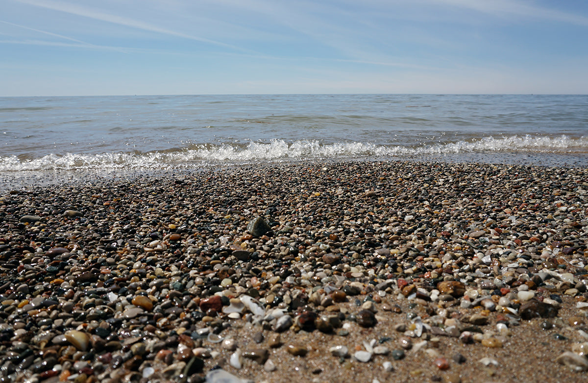 Free Colorful Pebble Beach and Waves Stock Photography