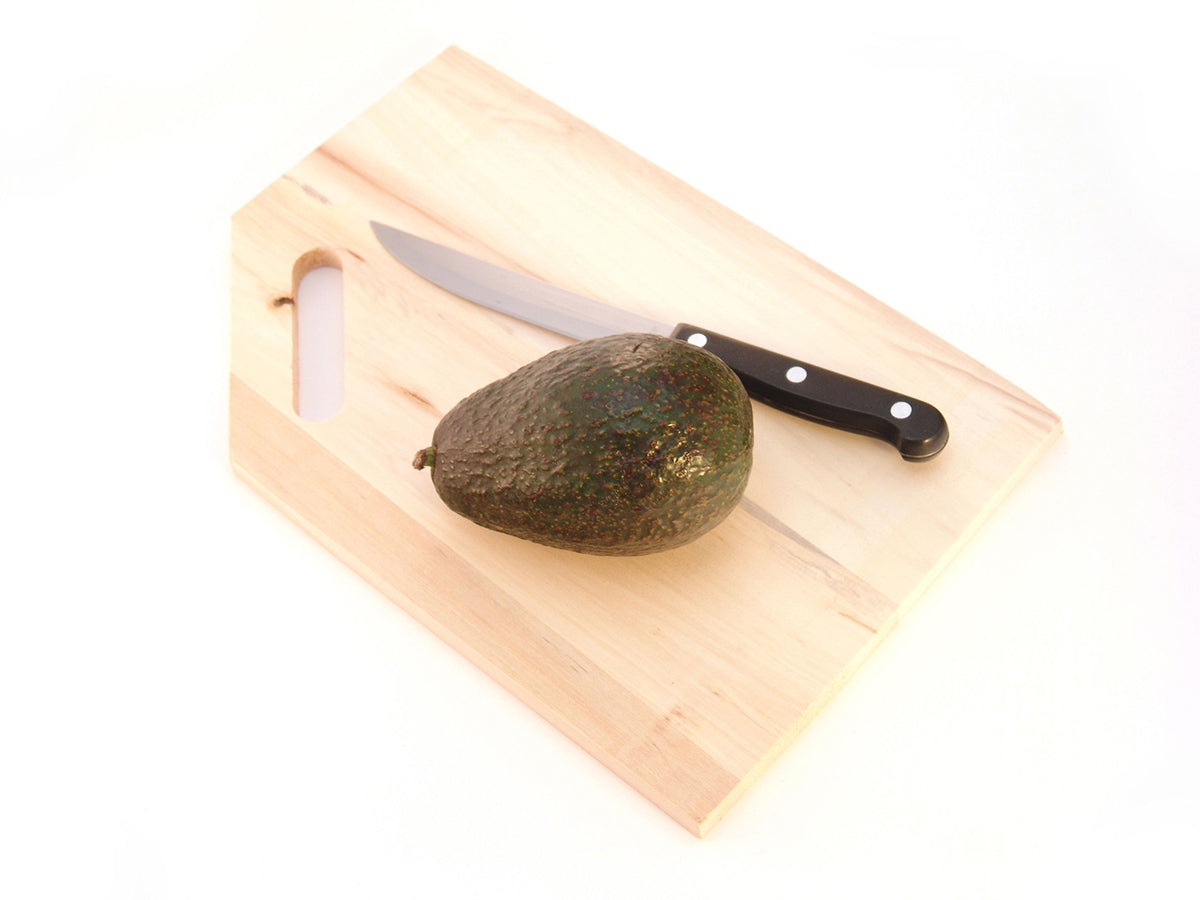 Free Whole Avocado on Cutting Board Stock Photography