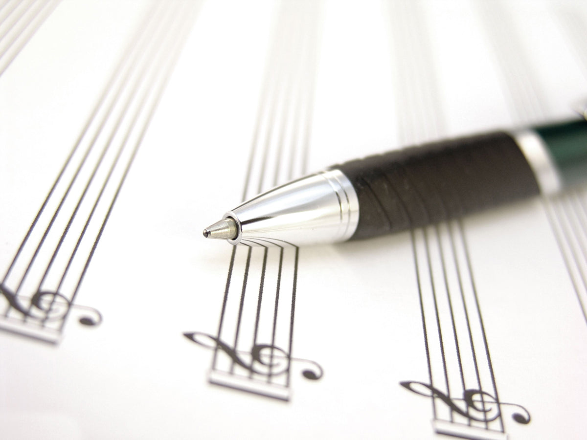 Free Pen Laying Across Sheet Music Page Stock Photography