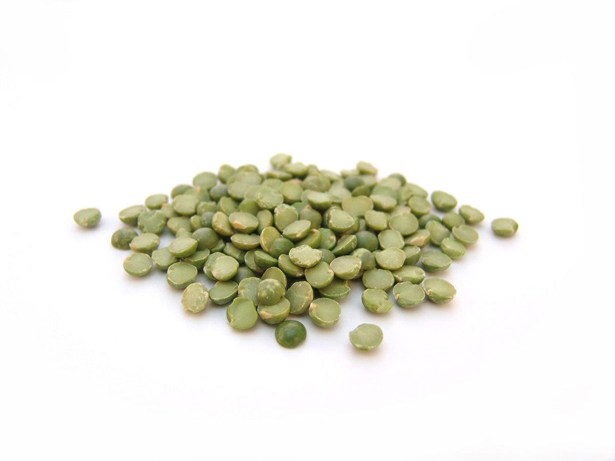 Free Green Split Peas on White Background Stock Photography