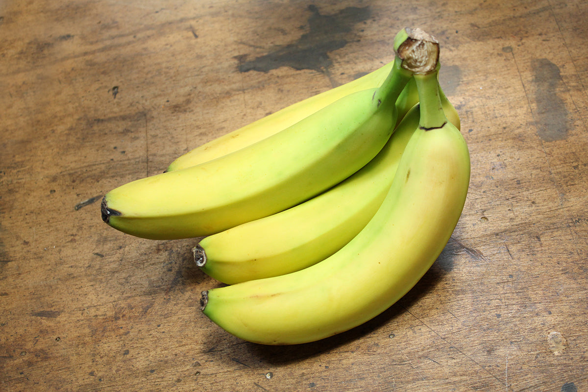 Free Bunch of Yellow Bananas on Table Stock Photography