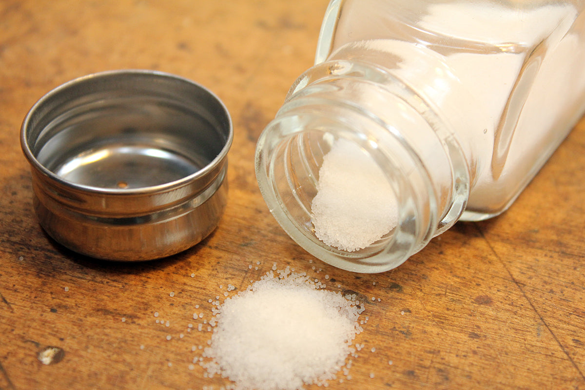 Free Spilled Salt from Glass Shaker Stock Photography