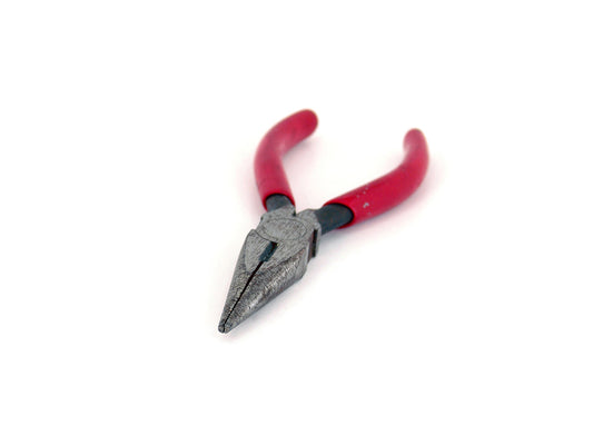 Free Rusty Needle-Nose Pliers with Red Handles Stock Photography