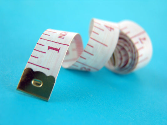 Free Flexible Measuring Tape on Blue Background Stock Photography