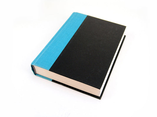Free Closed Hardcover Book with Teal Spine Stock Photography