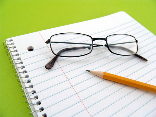Free Notebook with Glasses and Pencil Stock Photography