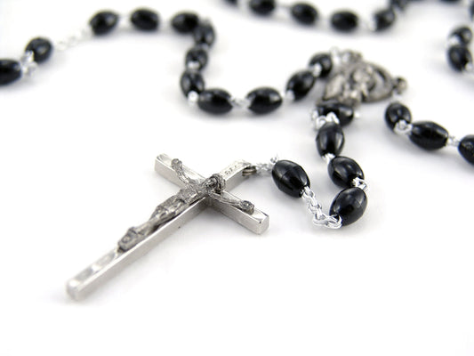 Free Rosary with Black Beads and Cross Stock Photography