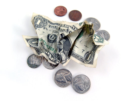 Free Crumpled Dollar and Loose Change Stock Photography