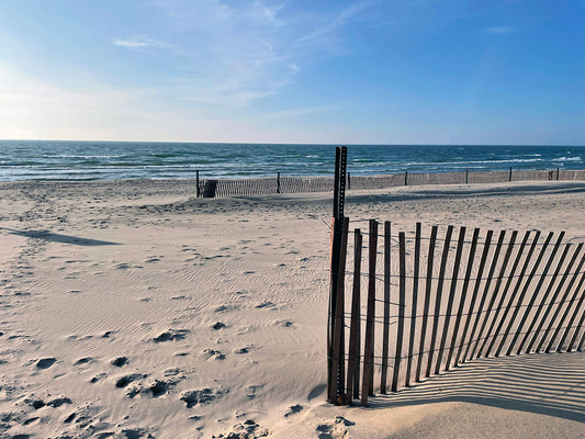 Free Beach Fence and Lake Waves Stock Photography