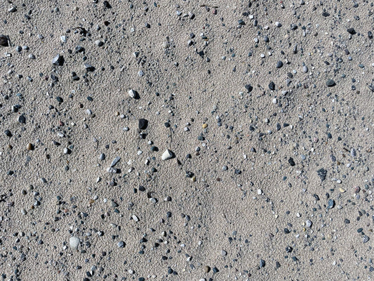 Free Pebbles on Beach Sand Stock Photography