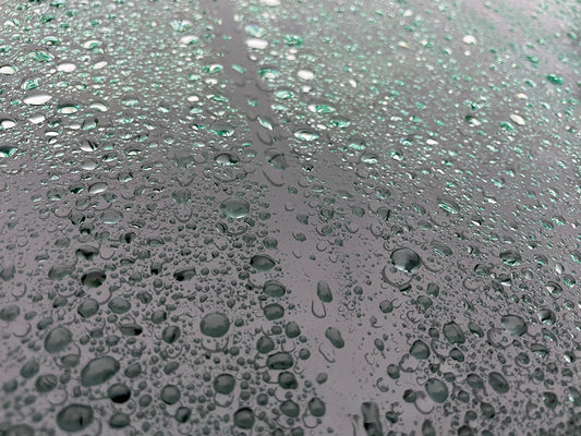 Free Green Tinted Water Droplets on Glass Stock Photography