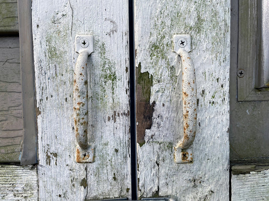 Free Rusty Door Handles on Peeling Painted Wood Stock Photography