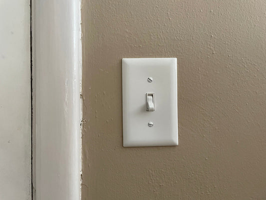 Free Light Switch on Beige Wall Stock Photography
