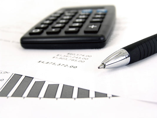Free Financial Documents with Calculator and Pen Stock Photography