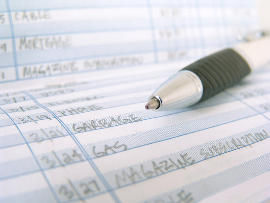 Free Pen on Handwritten Budget Sheet Stock Photography