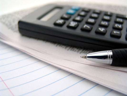 Free Pen and Calculator Close-Up Stock Photography