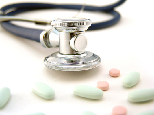 Free Stethoscope and Colorful Pills Stock Photography