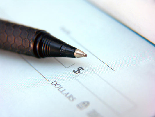 Free Pen on Check Stock Photography