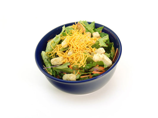 Free Shredded Cheddar Salad in Blue Bowl - Side View Stock Photography