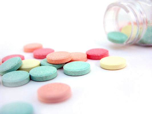 Free Assorted Antacid Tablets on White Background Stock Photography
