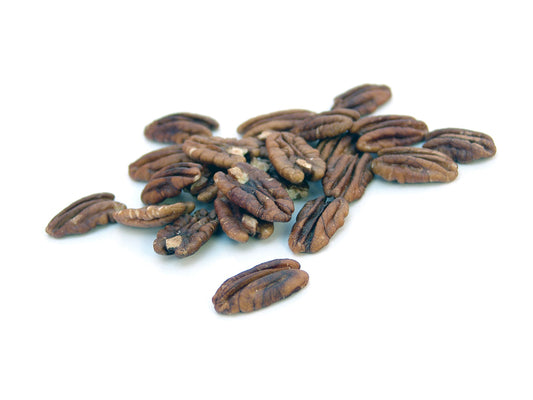 Free Scattered Pecans on White Surface Stock Photography