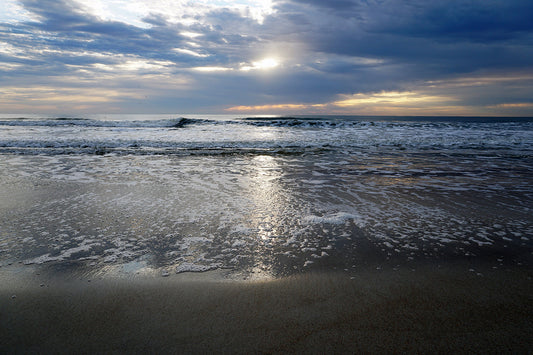 Free Waves and Foam Reflecting Sunset Light Stock Photography