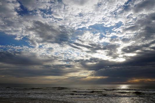 Free Cloud-Filled Sky Over Calm Ocean Stock Photography