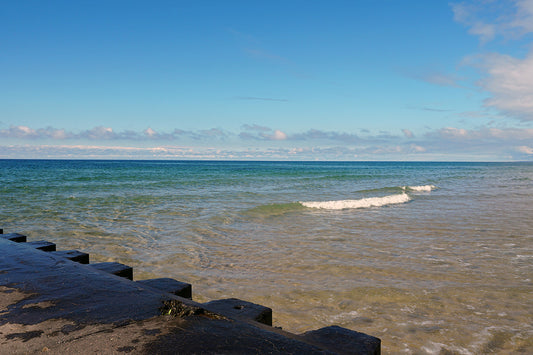 Free Lake Michigan with Stone Pier and Clear Waves Stock Photography