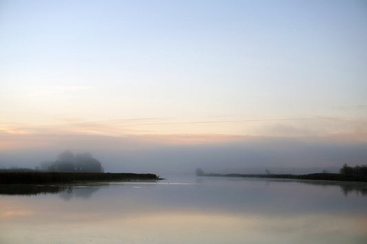 Free Foggy Morning View of a Quiet River Channel Stock Photography
