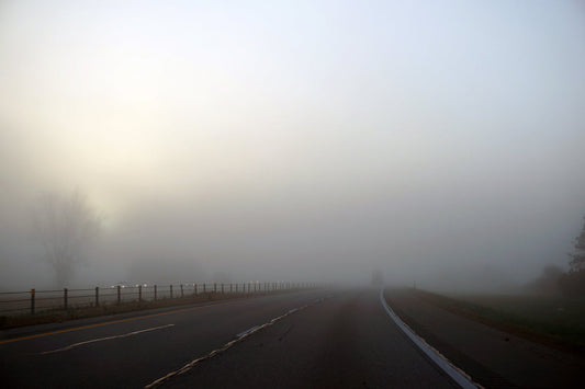Free Vehicles Emerging in Foggy Light Stock Photography