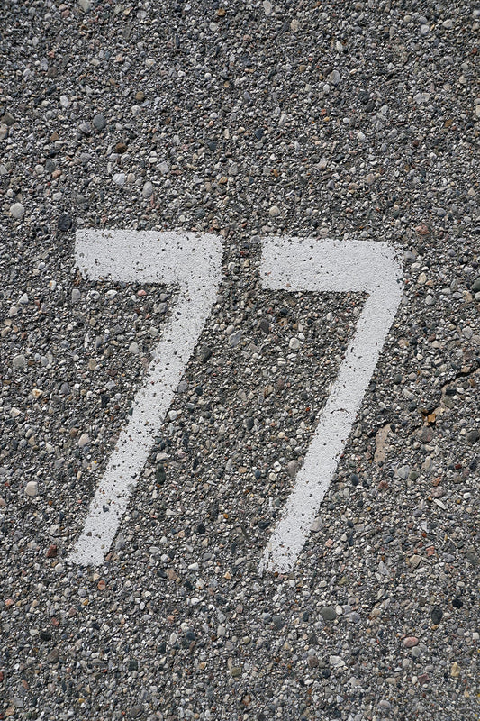 Free Parking Spot Number 77 - Closeup Stock Photography