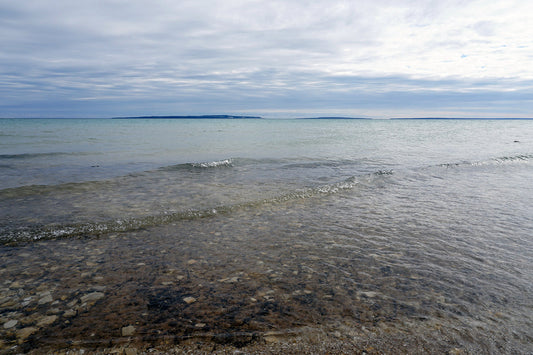 Free Waves on a Calm Lake Stock Photography
