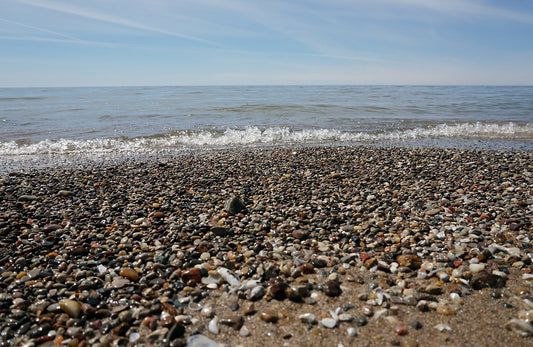 Free Colorful Pebble Beach and Waves Stock Photography