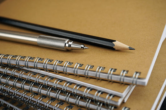 Free Stack of Spiral Notebooks and Pens Stock Photography