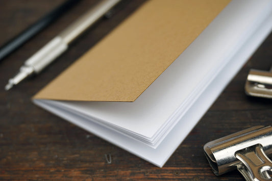 Free Kraft Notebook with Clips and Pens Stock Photography