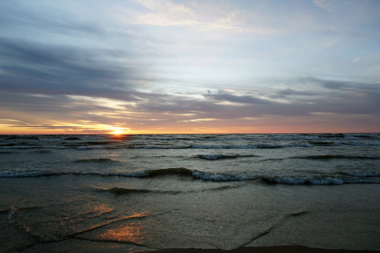 Free Sun Peeking Over Lake Waves Stock Photography