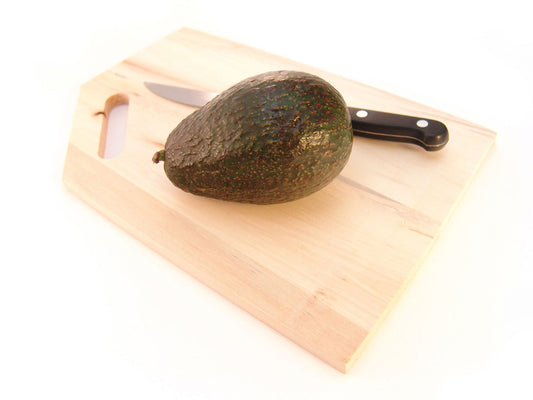Free Avocado on Cutting Board with Knife Stock Photography