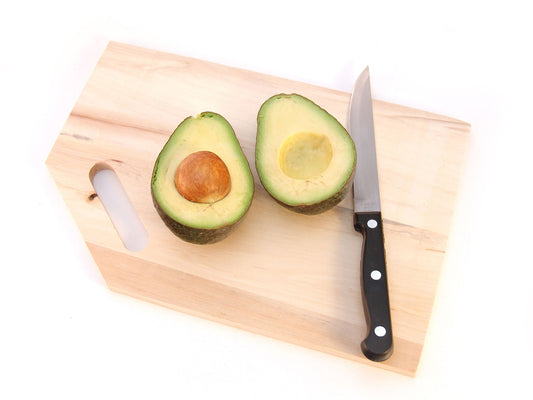 Free Halved Avocado with Knife Stock Photography