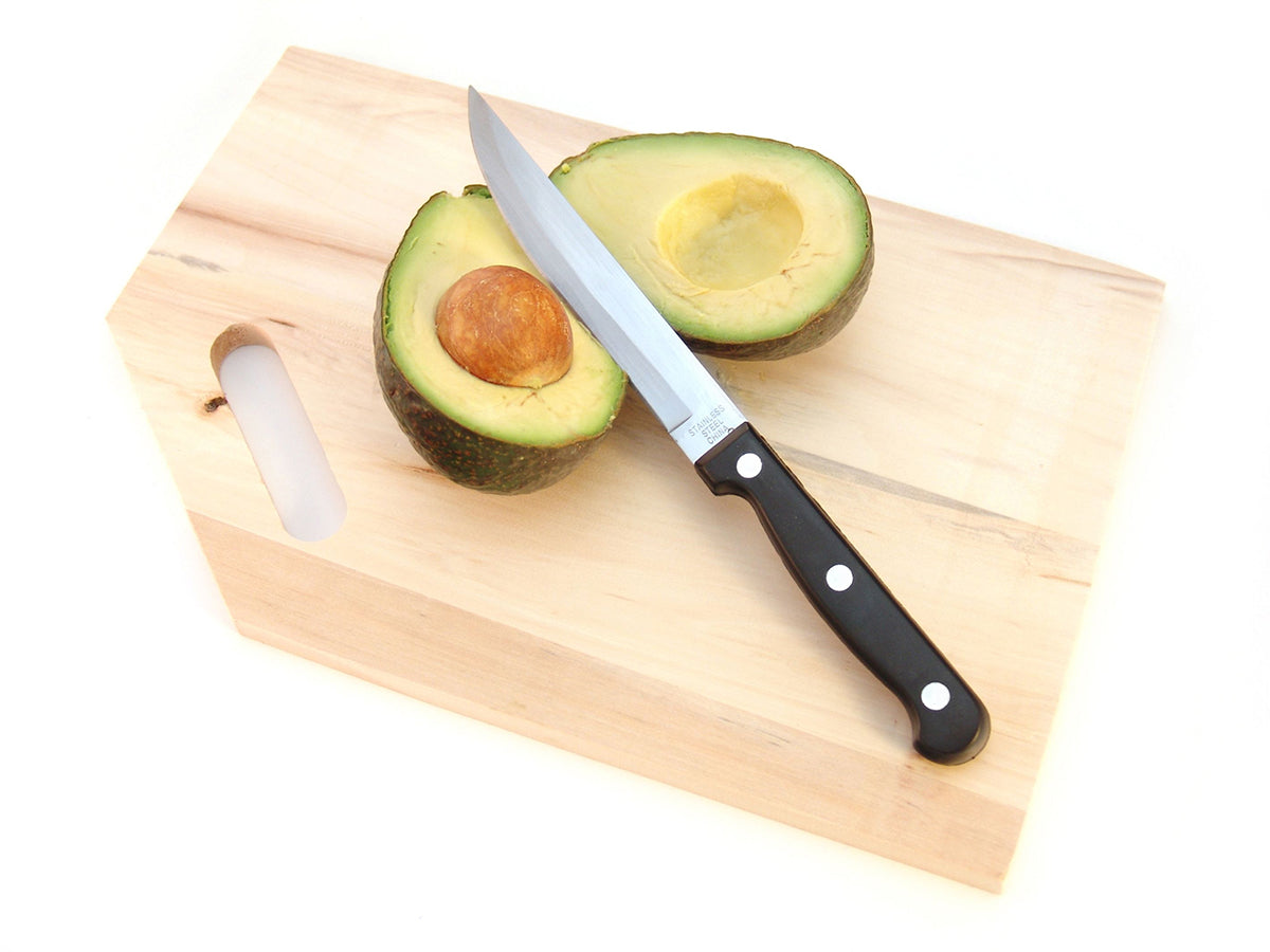 Free Knife Across Halved Avocado Stock Photography