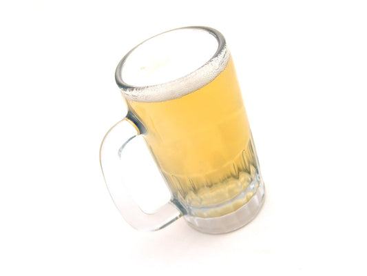 Free Beer Mug Tilted on White Stock Photography