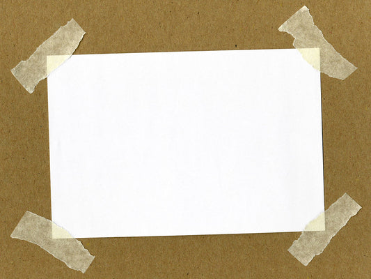 Free Blank Paper Taped to Kraft Surface Stock Photography